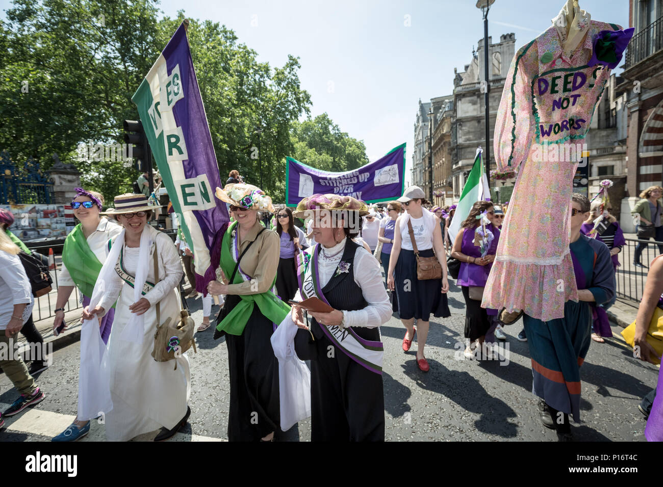 London, UK. 10th June 2018. Thousands of women join Processions 2018. Dressing in the green, white and purple tri-colour scheme of the Suffragette’s Women's Social and Political Union, they marched from Hyde Park to Parliament Square to mark 100 years since the Representation of the People Act, which gave British women the right to vote and stand for public office in the UK. Credit: Guy Corbishley/Alamy Live News Stock Photo