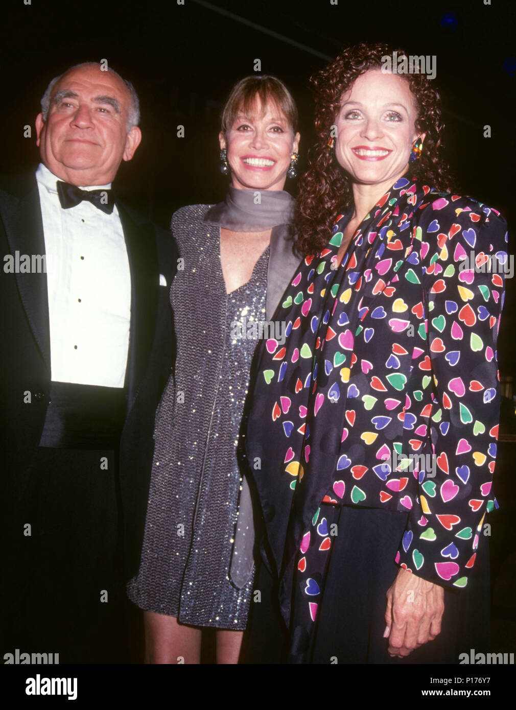 BEVERLY HILLS, CA - OCTOBER 04: (L-R) Actor Ed Asner, actress/honoree Mary Tyler Moore and actress Valerie Harper attend the Los Angeles Chapter Juvenile Diabetes Research Foundation International Presents the First Annual Promise Ball on October 4, 1991 at the Beverly Hilton Hotel in Beverly Hills, California. Photo by Barry King/Alamy Stock Photo Stock Photo