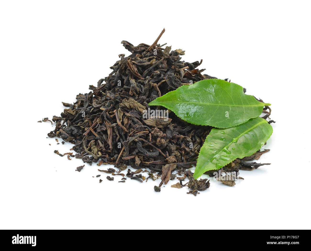 dry black tea leaves isolated on white Stock Photo Alamy