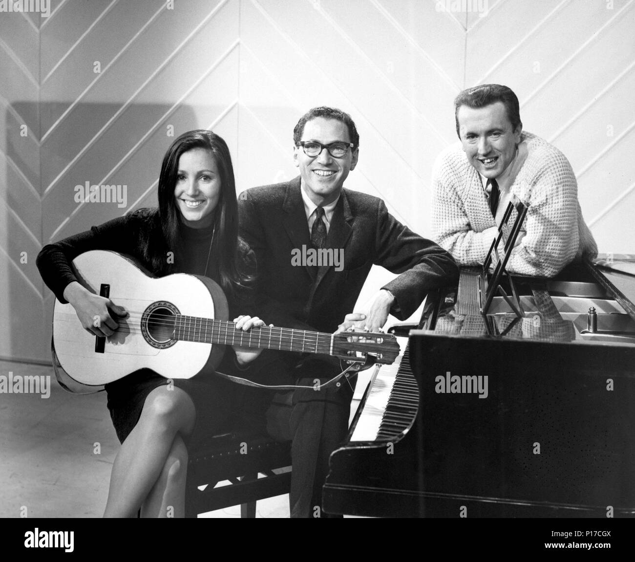 File photo dated 10/03/66 of David Frost (right), host of The Frost Report, with two American regulars Tom Lehrer and Julie Felix, at the BBC Television Theatre in Shepherd's Bush. Folk singer Felix is celebrating turning 80 by releasing a new CD. Stock Photo