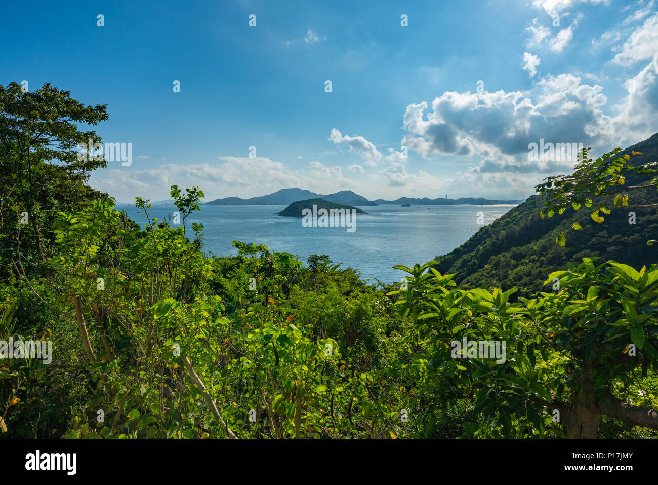 Green islands floating off the coast of Stanley, Hong Kong Stock Photo