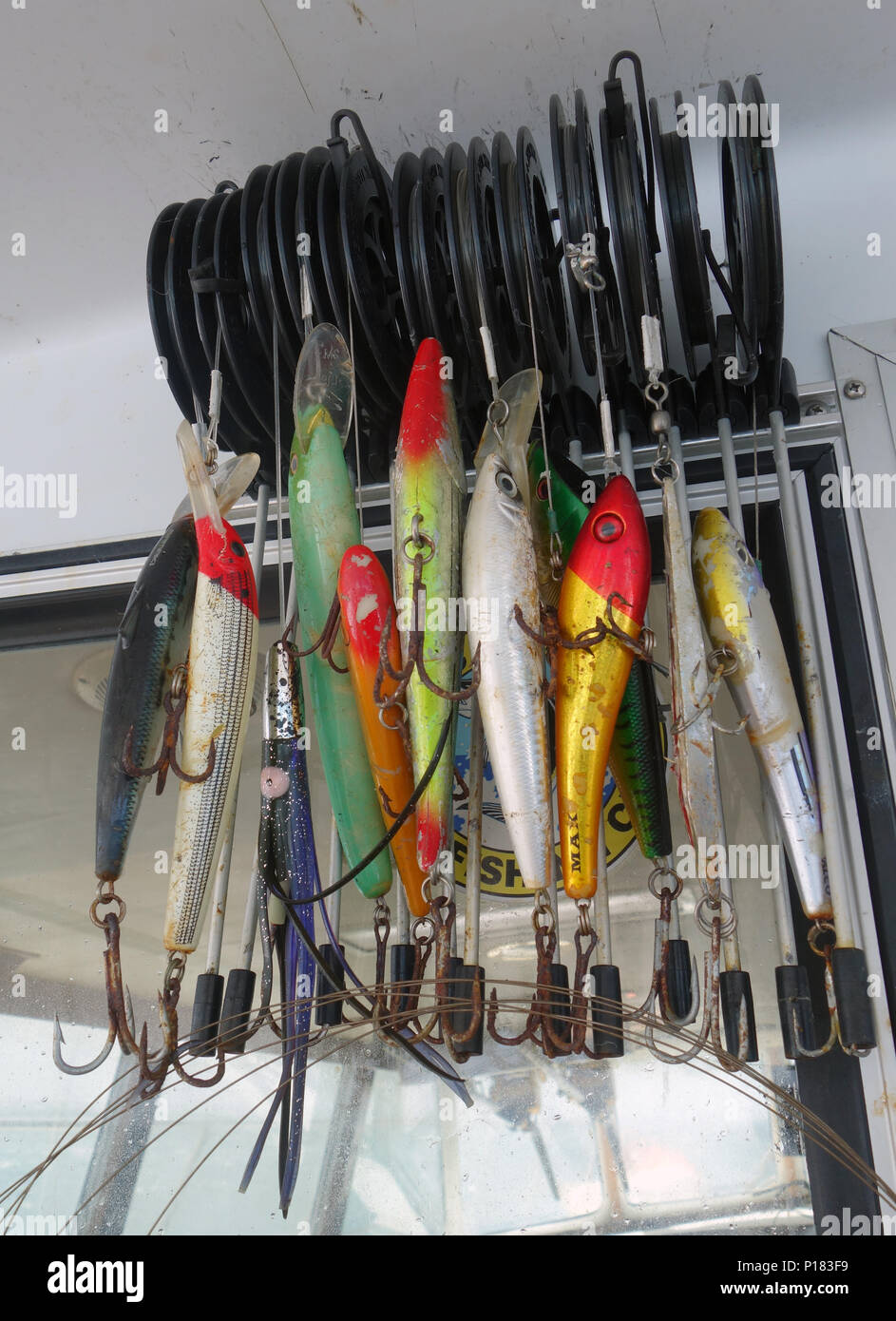 Different brightly coloured lures ready to be deployed from charter game fishing vessel in the Coral Sea off Cooktown, Queensland, Australia. No PR Stock Photo