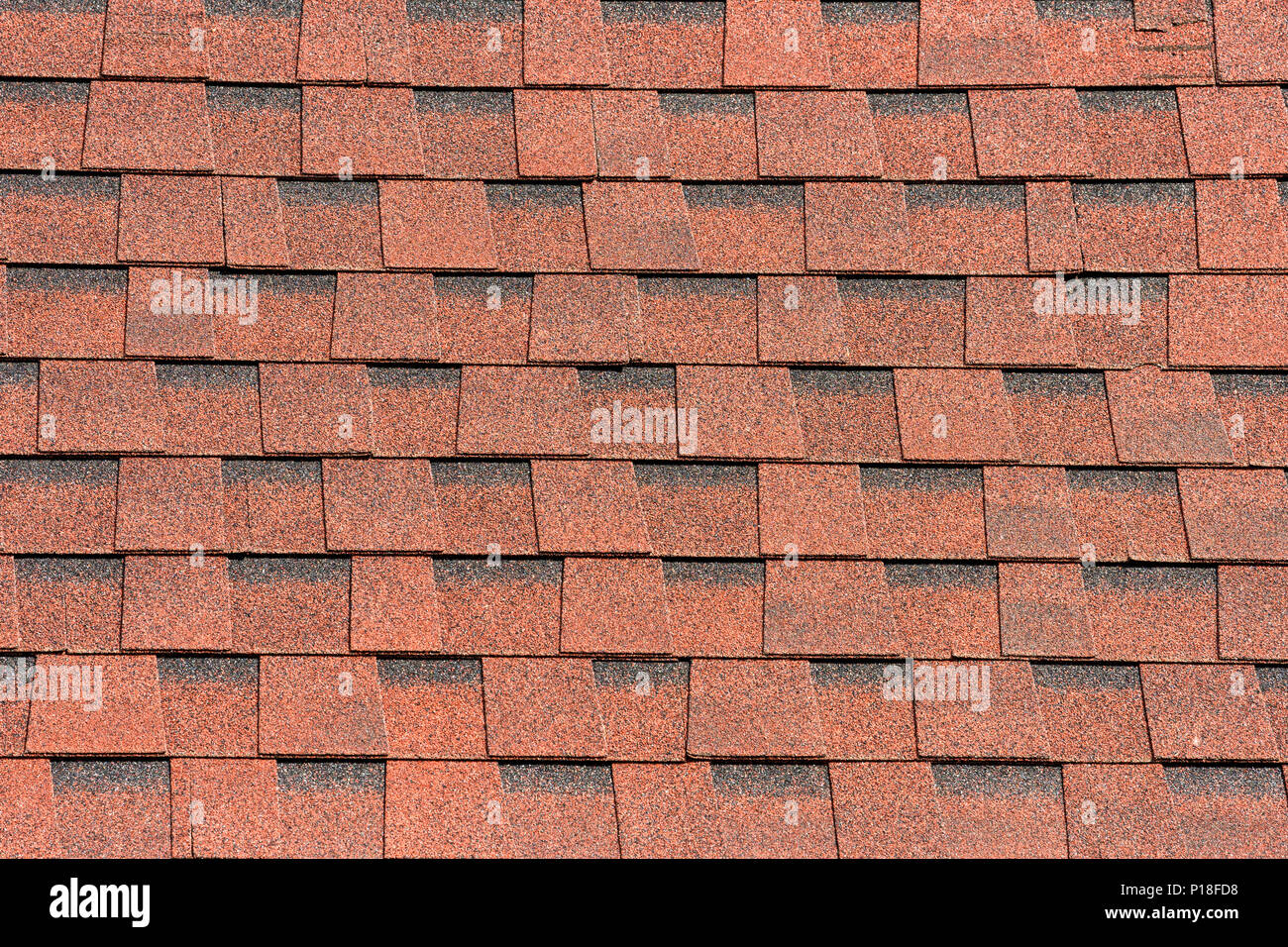 Brown shingle roof tiles pattern background with rough texture Stock