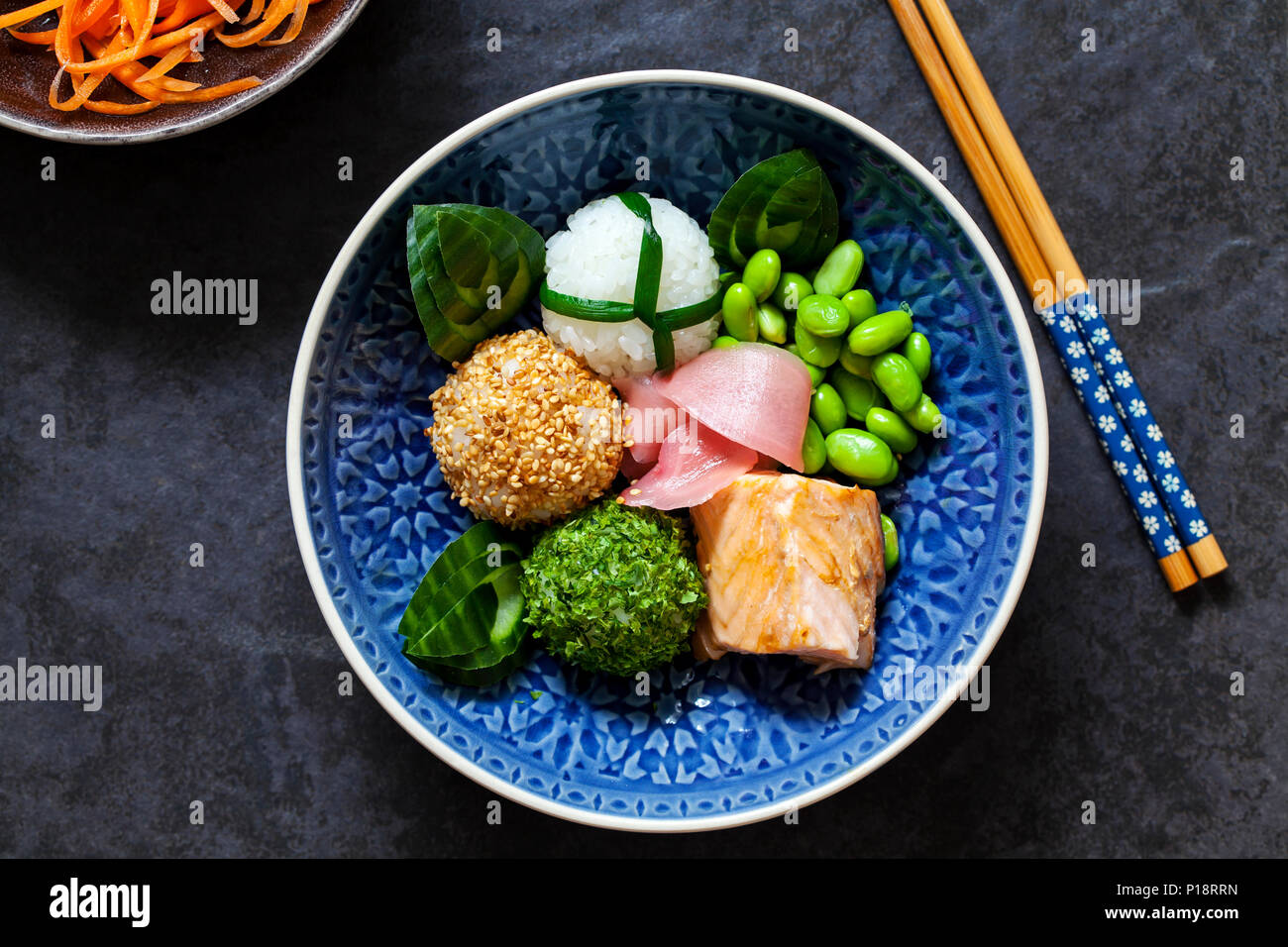 Japanese onigiri sushi rice balls with salmon and soy beans Stock Photo