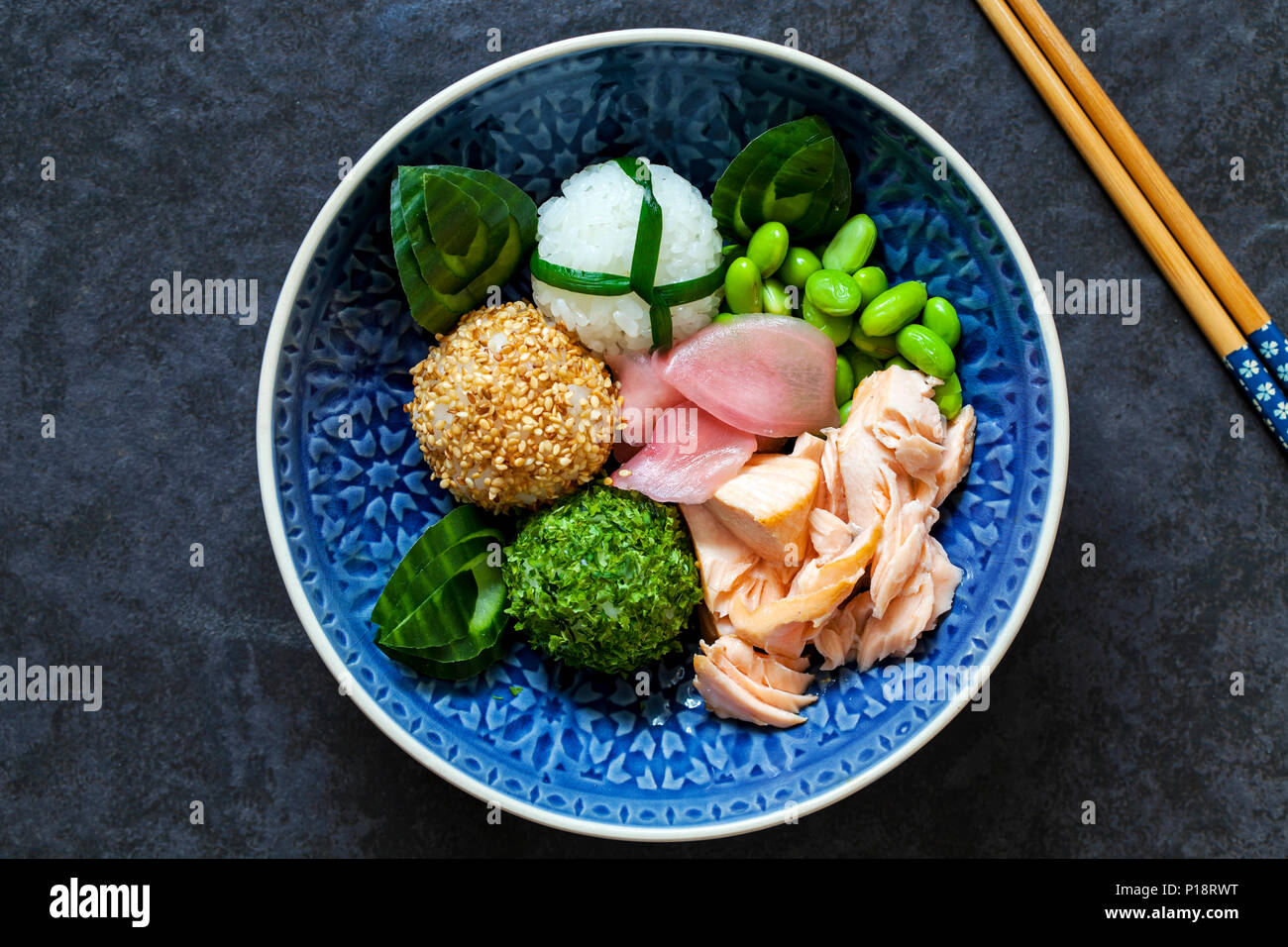 Japanese onigiri sushi rice balls with salmon and soy beans Stock Photo