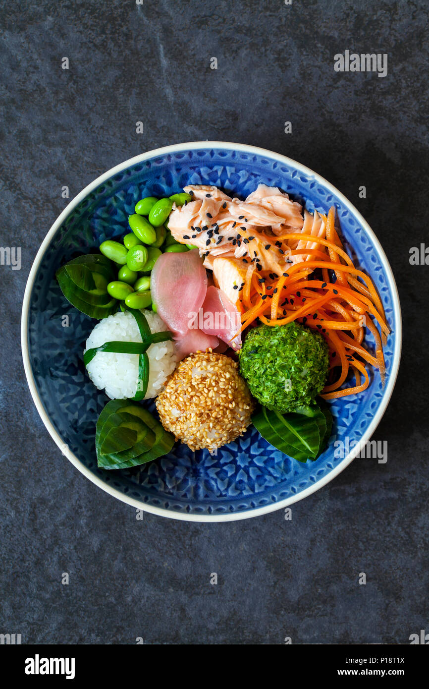 Japanese onigiri sushi rice balls with salmon and soy beans Stock Photo