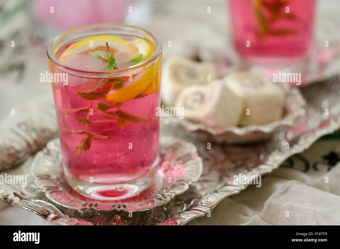 Turkish delight and Turkish traditional ottoman ramadan Sherbet Fresh sherbet  with lemon,sweet basil ,  mint and ice, selective focus Stock Photo