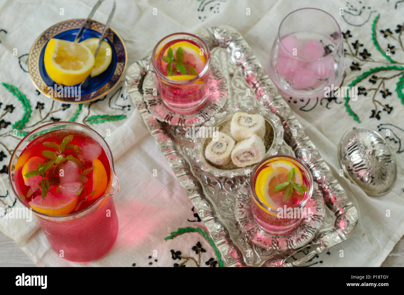 Turkish delight and Turkish traditional ottoman ramadan Sherbet. Fresh sherbet  with lemon,sweet basil ,  mint and ice, top view Stock Photo