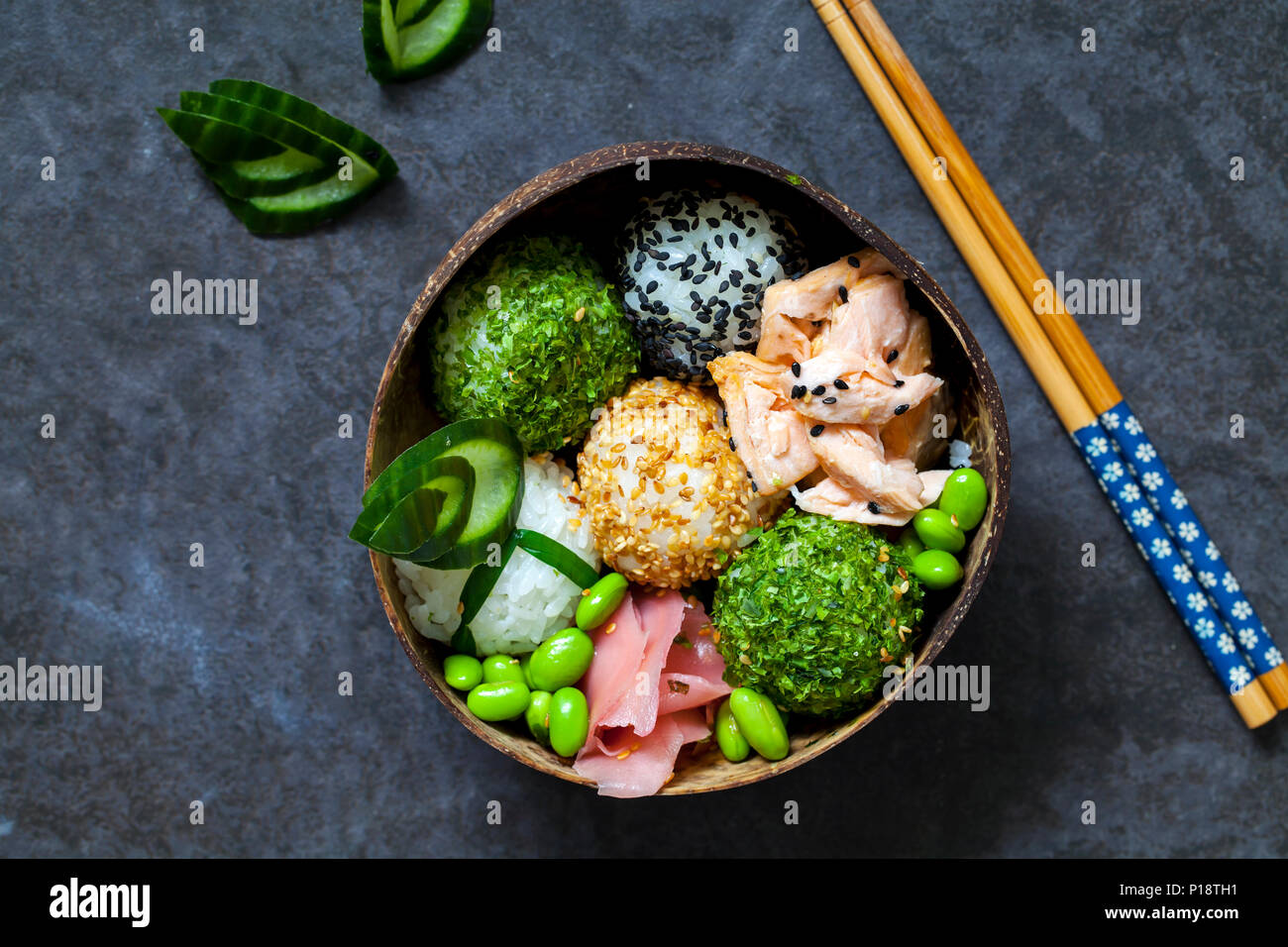Japanese onigiri sushi rice balls with salmon and soy beans Stock Photo