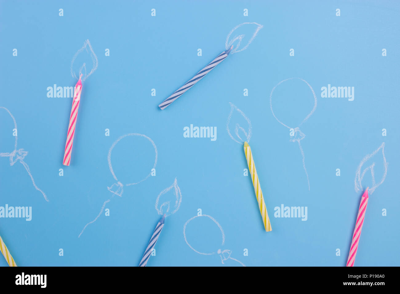 Variety of birthday candles on blue background Stock Photo - Alamy