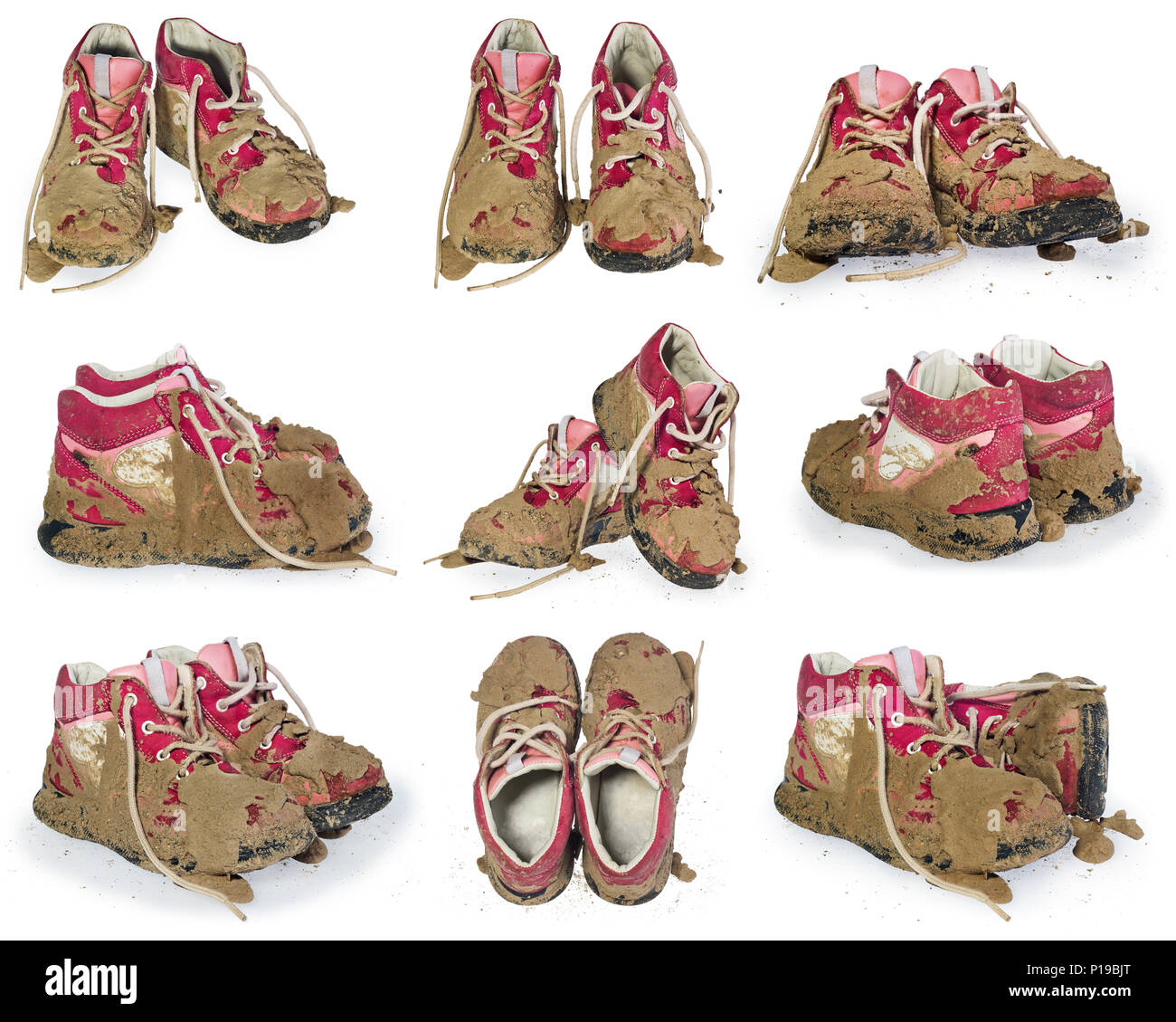 Children's tiny shoes covered with mud. Dirty leggings for children's feet in raspberry and white color isolated on a white background. Stock Photo