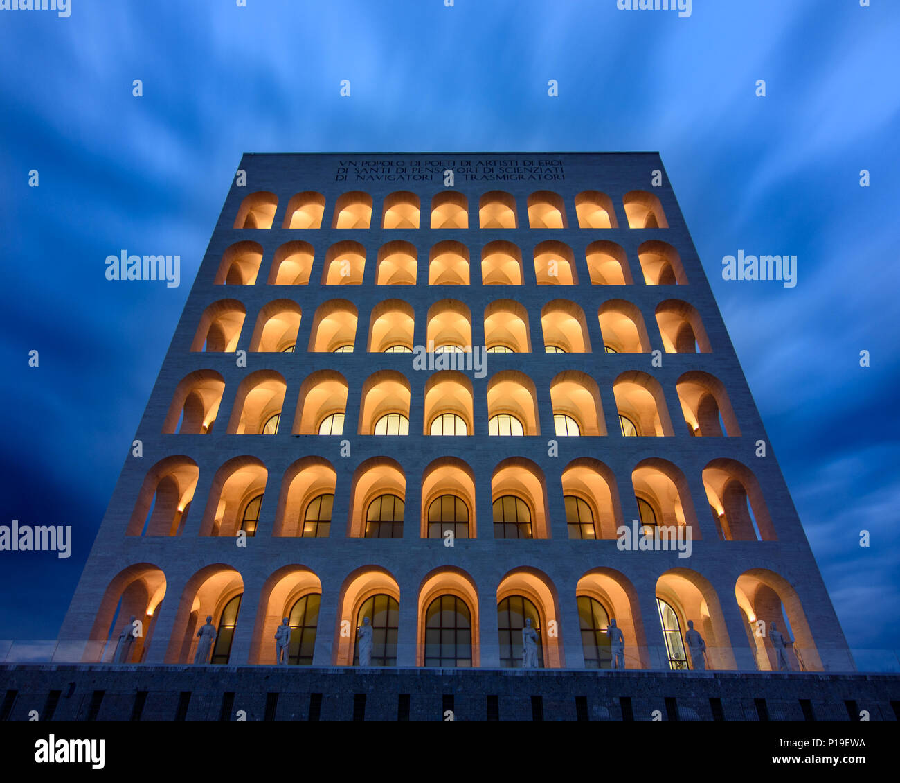 Rome, Italy - March 26, 2018: Clouds rushing in the wind create a dramatic backdrop to the monumental architecture of the Palazzo della Civita Italian Stock Photo