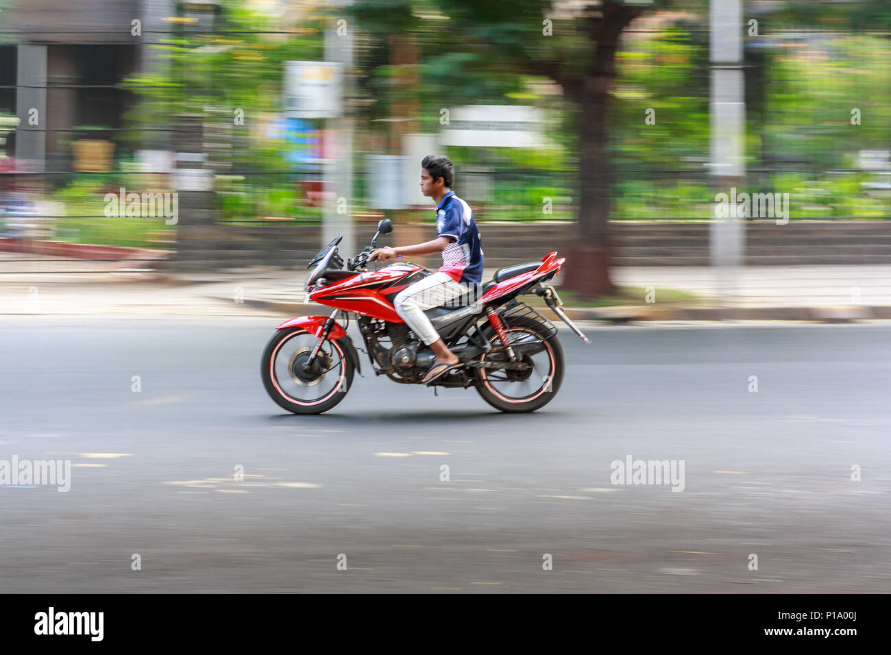 MUMBAI, INDIA - DECEMBER 4, 2016 : A family riding a motor bike on streets of Mumbai Stock Photo