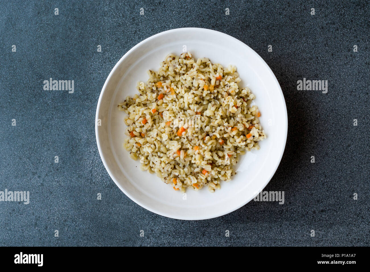 Cooked Bulgur Rice with Chia Seeds and Carrot in Plate Ready to Eat