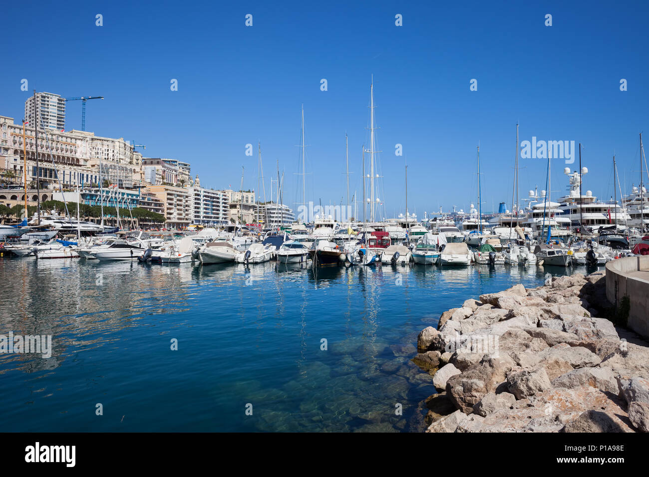 Monaco principality, boats, yachts and sailboats at Port Hercule on Mediterranean Sea Stock Photo