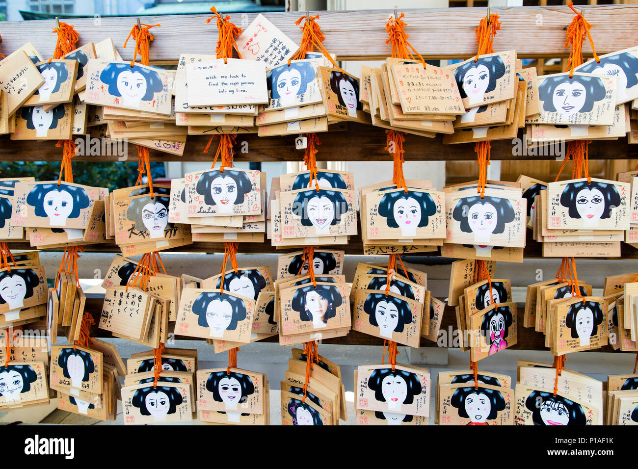 Wooden Plaques known as Ema left by worshippers who write their prayers or wishes on at Ohatsu Tenjin Shrine, Osaka, Japan. Stock Photo