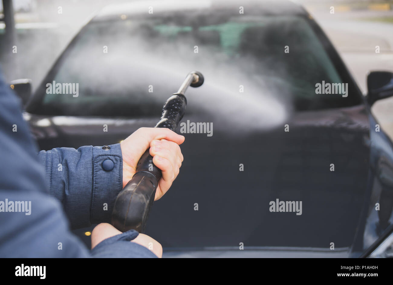Car wash using high pressure water jet Stock Photo - Alamy