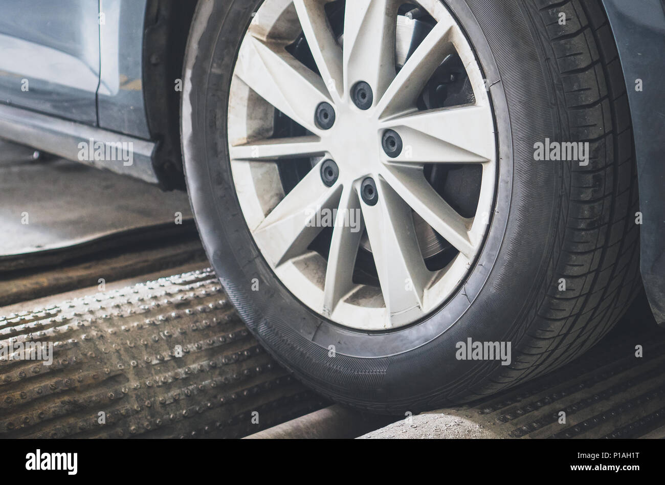 Wheel alignment and balancing in auto service. Vehicle inspection Stock
