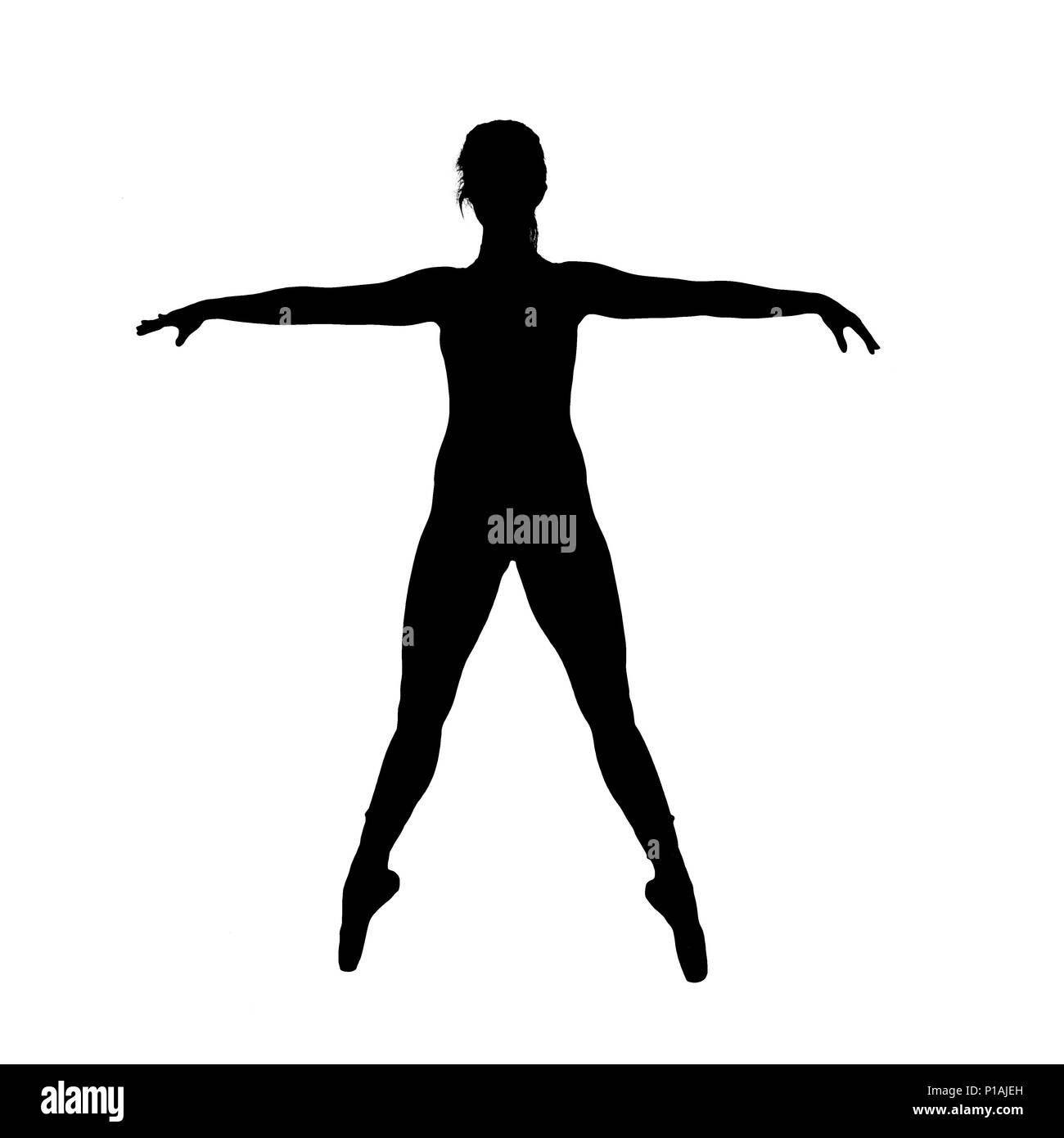 Digitally enhanced image of a silhouette of a female Ballet Dancer as she balances on her toes with outstretched hands Stock Photo