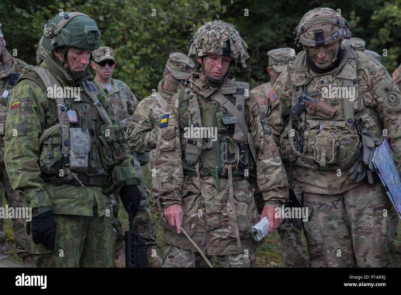 U S Army Lt Col Steve Gventer Right Of The 2nd Squadron 2nd Calvary Regiment British Army Lt Col Mike Cornwell Center Of The Princess Of Wales S Royal Regiment And Lithuanian Army Soldier