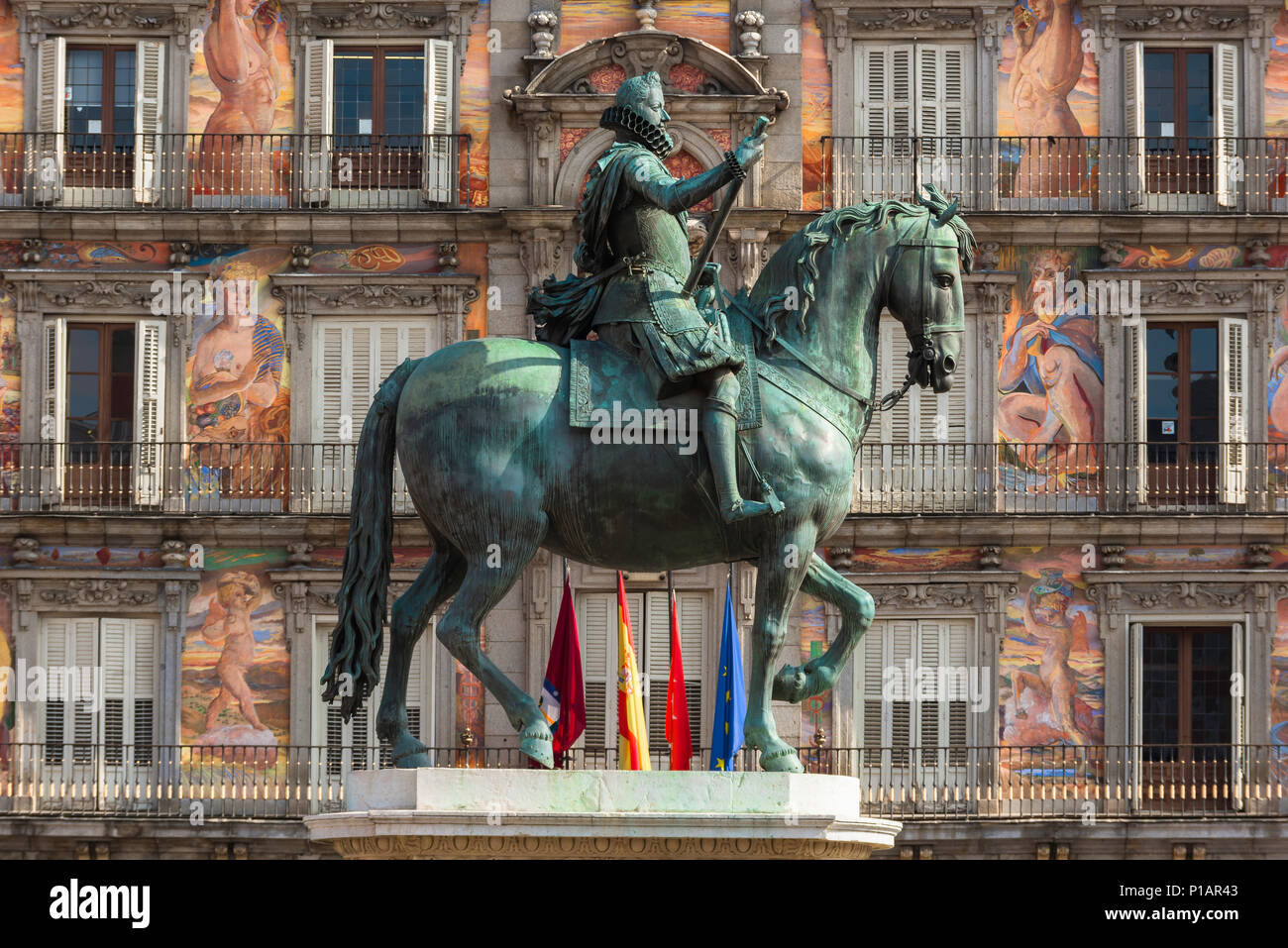 Madrid Plaza Mayor, view of the statue of Felipe iii pictured against the colorful fresco covered Casa Panaderia in the Plaza Mayor in Madrid, Spain. Stock Photo