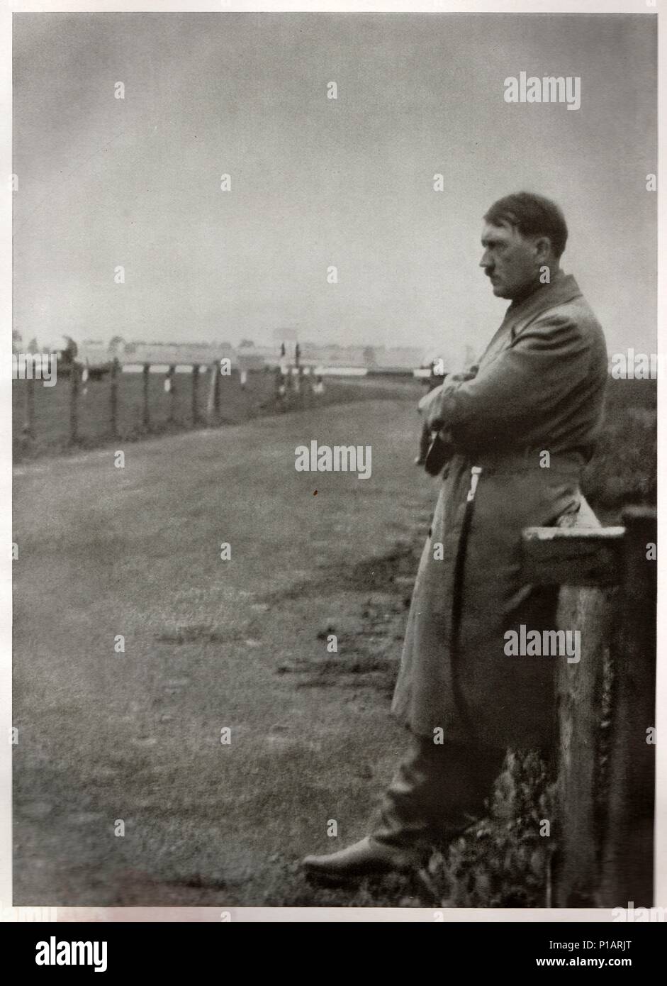 GERMANY - 1932: Photo of Adolf Hitler, leader of nazi Germany. Lonesome Hitler on the road. Reproduction of antique photo Stock Photo