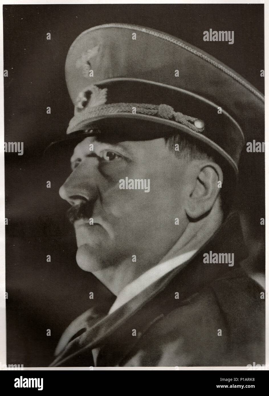 LINZ, AUSTRIA -  MARCH 12, 1938: Hitler declares Germany and Austria (Ostmark) united as one entity, the beginning of the Großdeutsches Reich (Greater German Empire). Emotional speech from the balcony of the Linz town hall. Reproduction of antique photo. Stock Photo