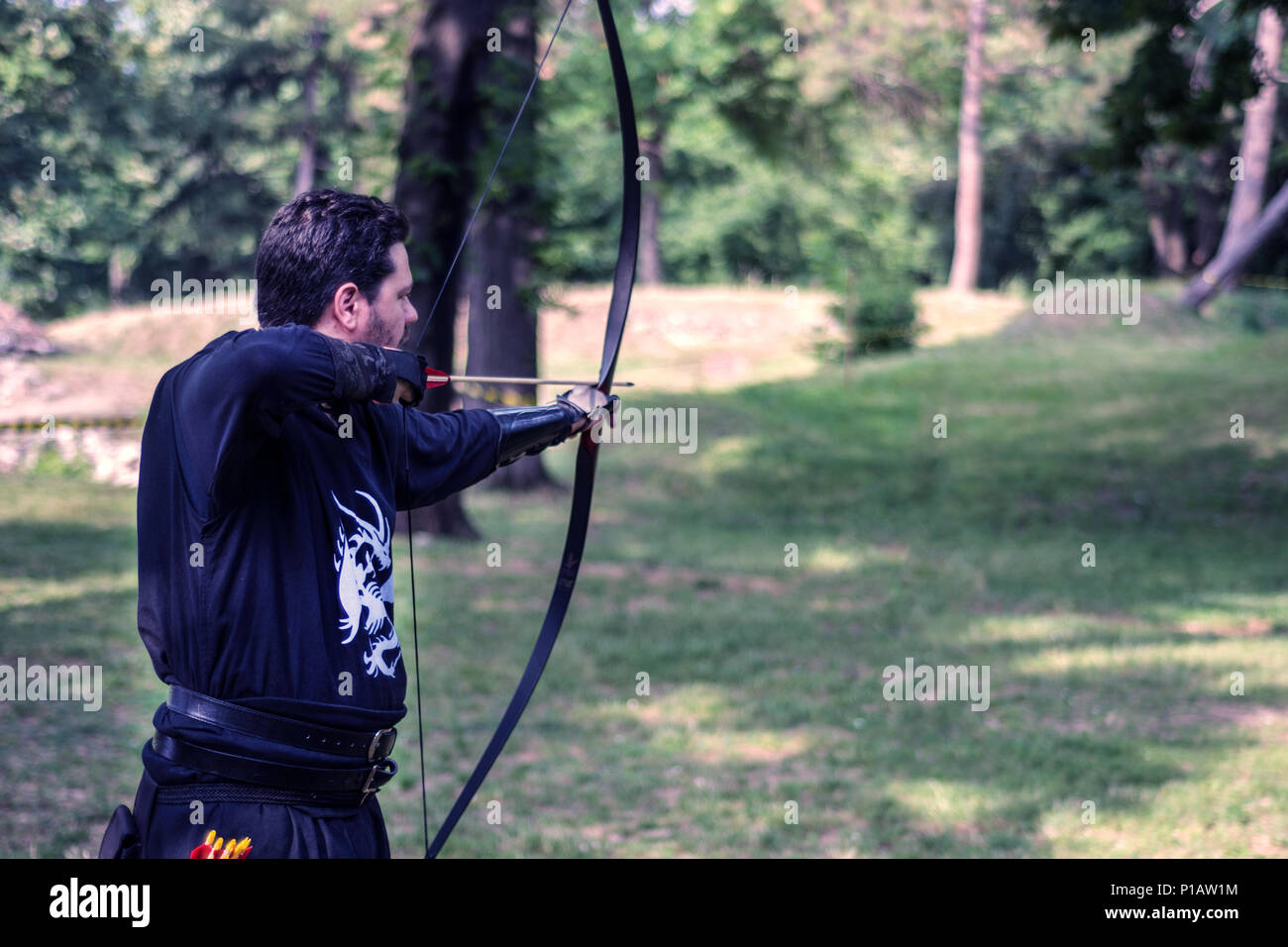 Nis, Serbia June 10, 2018 Medieval archer with wooden bow shoot