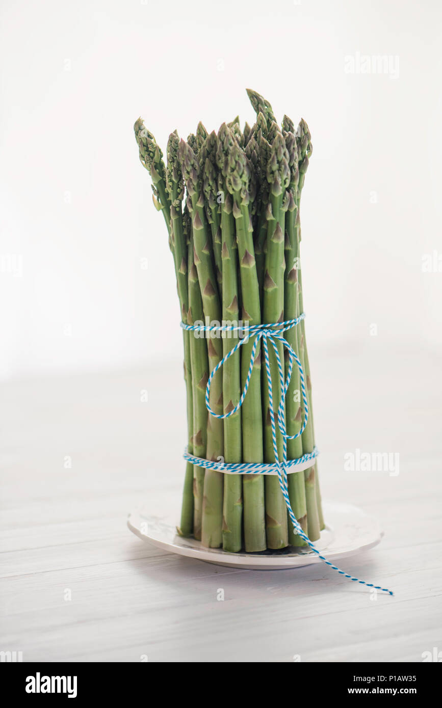 Asparagus bunch standing up straight . Stock Photo