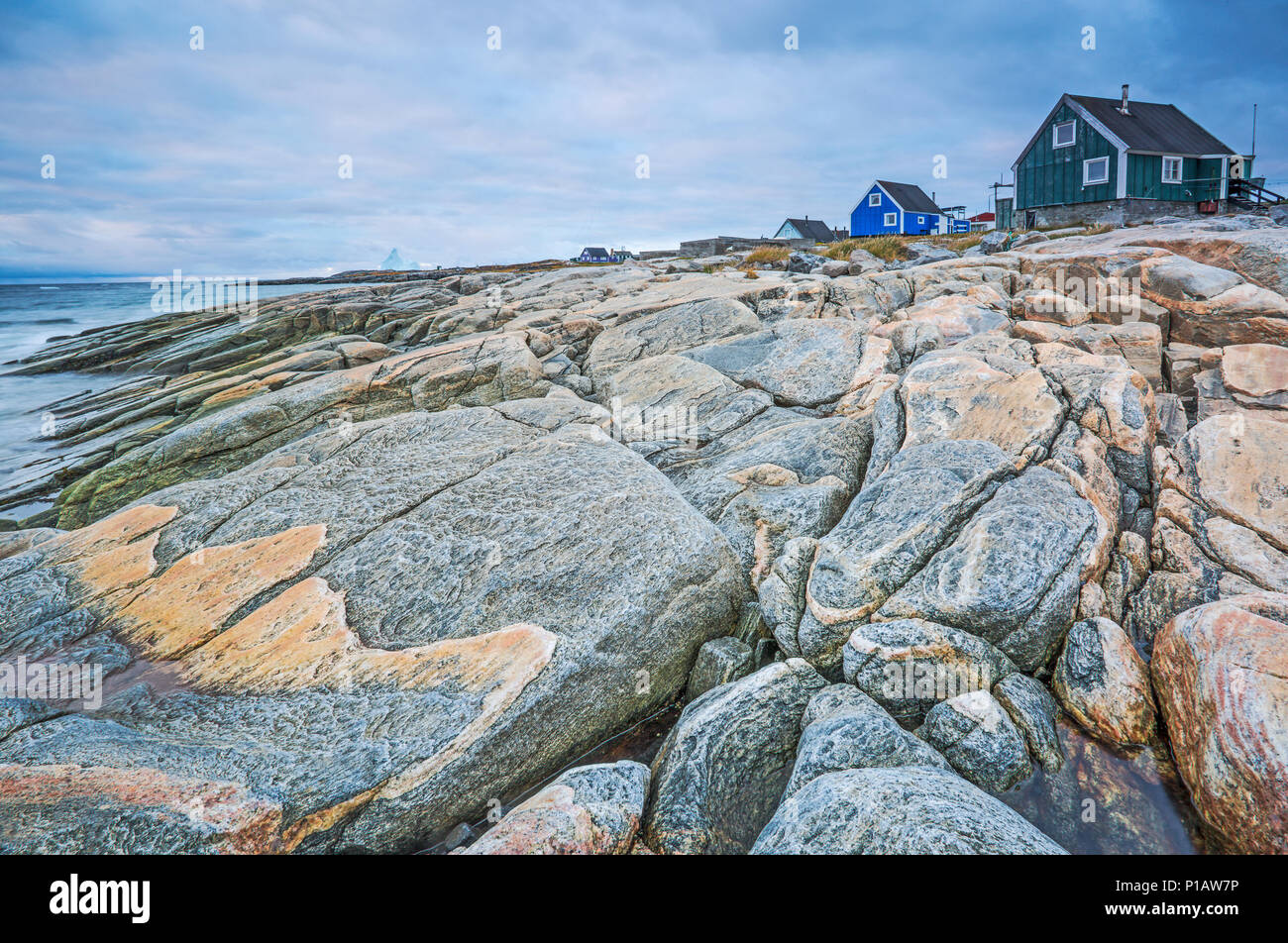 Craggy rocks along fishing village, Disko Island, Greenland Stock Photo