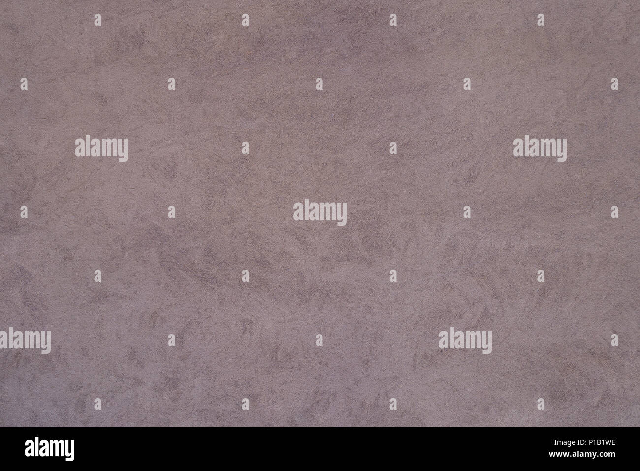 reddish grey cement stucco wall surface full frame backdrop Stock Photo