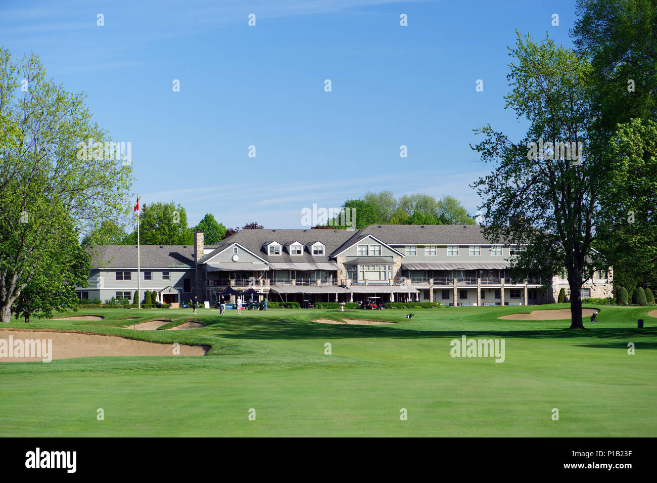 View of a green and of the expansive clubhouse of the exclusive Royal