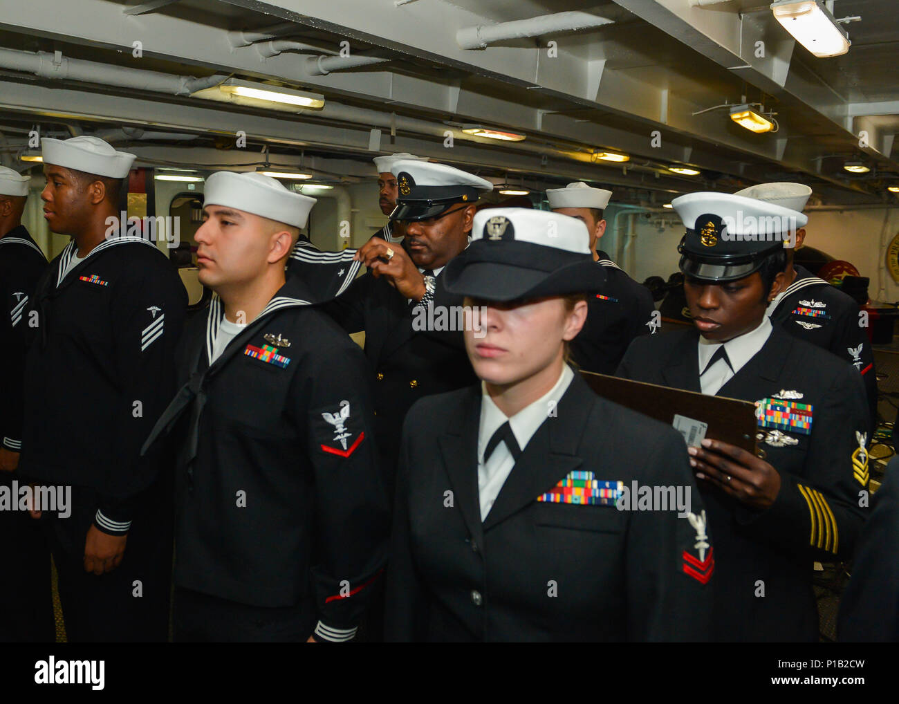 Sailors conduct a service dress blue uniform inspection aboard the aircraft carrier USS Theodore Roosevelt (CVN 71) while the ship is moored in San Diego undergoing a scheduled Planned Maintenance Availability. The Sailors conduct a service dress blue uniform inspection aboard the aircraft carrier USS Theodore Roosevelt (CVN 71) while the ship is moored in San Diego undergoing a scheduled Planned Maintenance Availability. The