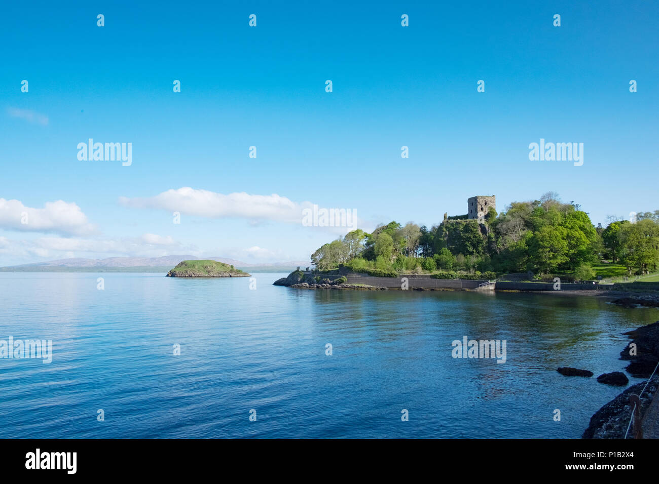 Castle on headland coastal scene near Oban, Argyll, Scotland Stock Photo
