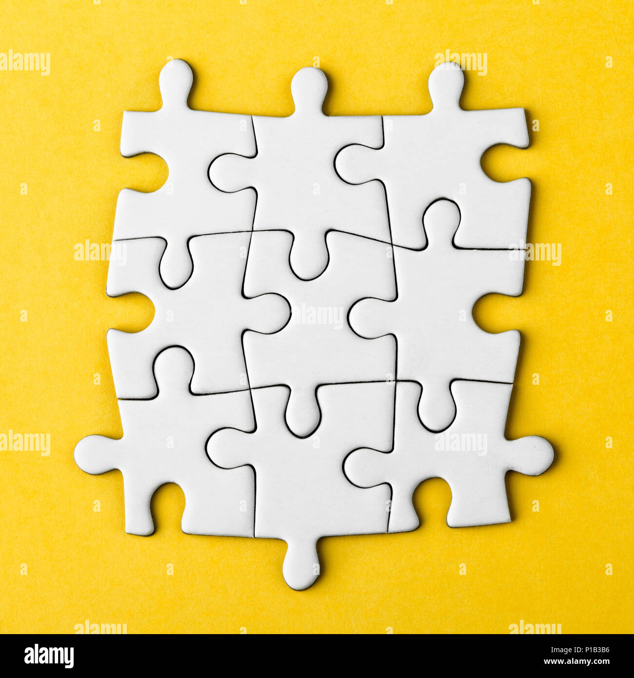 Connected blank puzzle pieces Stock Photo