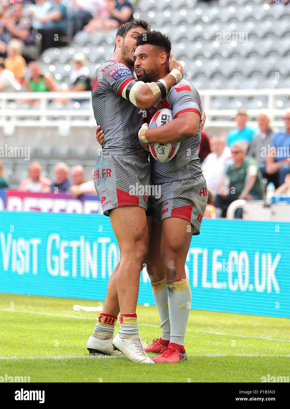 Catalan Dragons Brayden Wiliame with Catalan Dragons Jodie Broughton after he scores during the Betfred Super League, Magic Weekend match at St James' Park, Newcastle Stock Photo