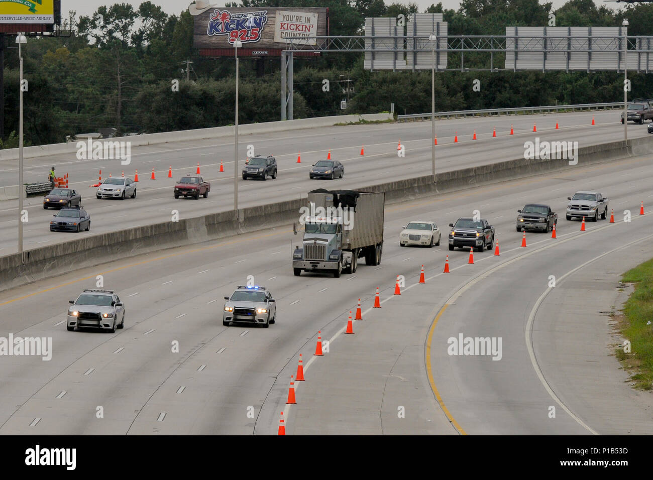 Patrolmen with the S.C. Highway Patrol lead the first vehicles down interstate I-26 westbound after the lane reversal out of Charleston as part of the evacuation ordered by the Governor of South Carolina.  Hurricane Matthew peaked as a Category 4 hurricane in the Caribbean and was projected to pass over the southeastern U.S., including the S.C. coast. Approximately 1,400 S.C. National Guard Soldiers and Airmen were activated Oct. 4, 2016, to support coastal evacuations after Governor Nikki Haley declared a State of Emergency. (U.S. Army National Guard photo by Staff Sgt. Kevin Pickering, 108th Stock Photo