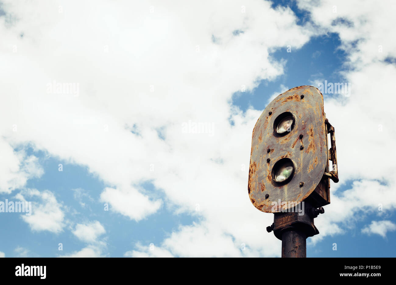 Old rusty train semaphore with sky background in the old station of Zaranda, Spain Stock Photo