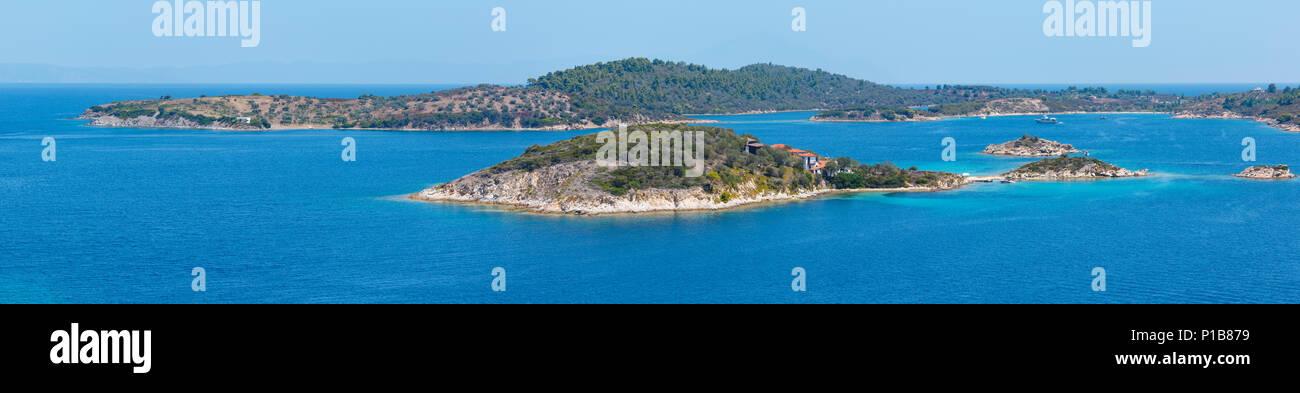 Beautiful summer Aegean Sea coast landscape (near Lagonisi , Sithonia, Halkidiki, Greece). Three shots stitch high-resolution panorama. People are unr Stock Photo