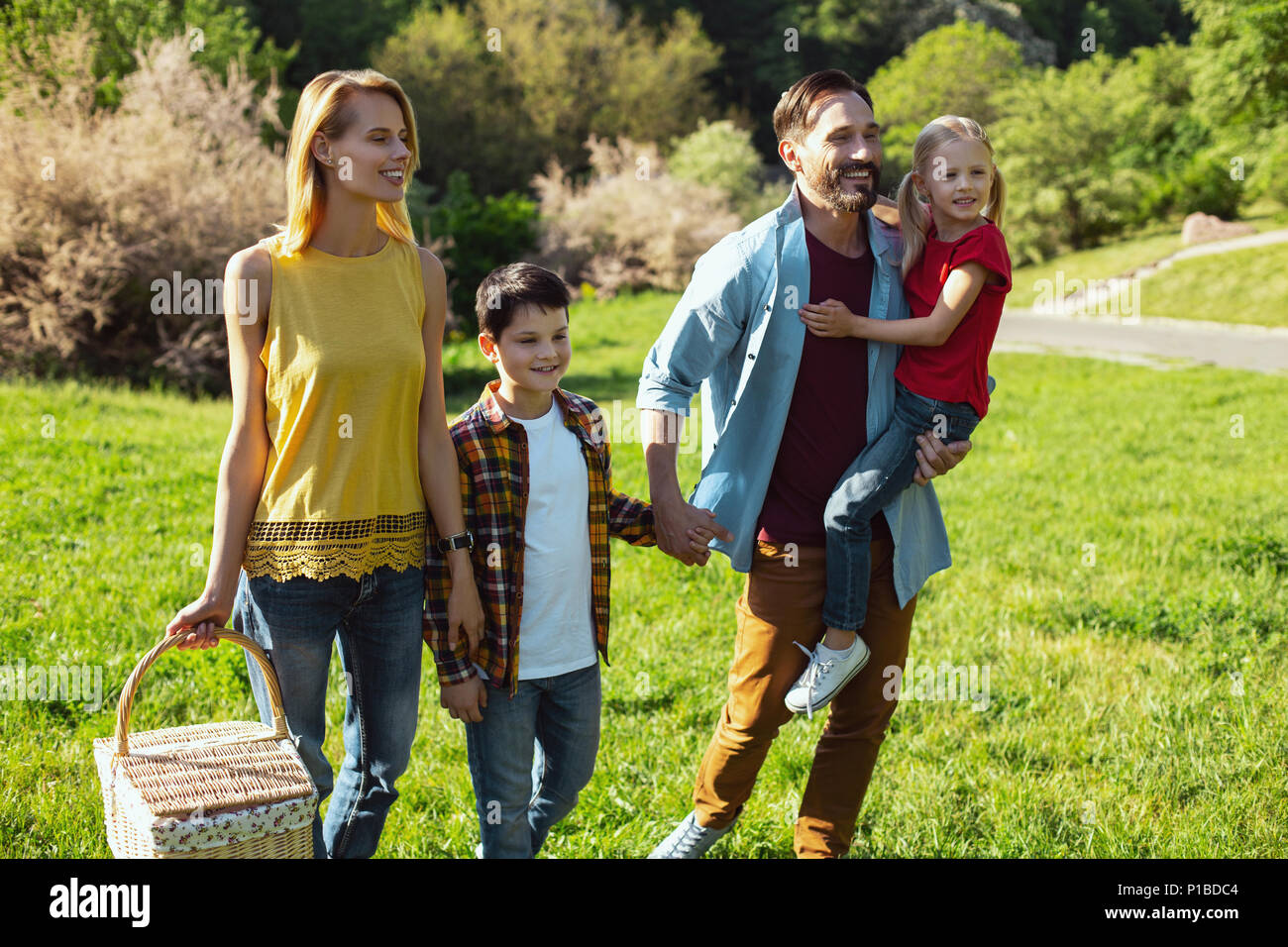 Content family having a walk in the park Stock Photo