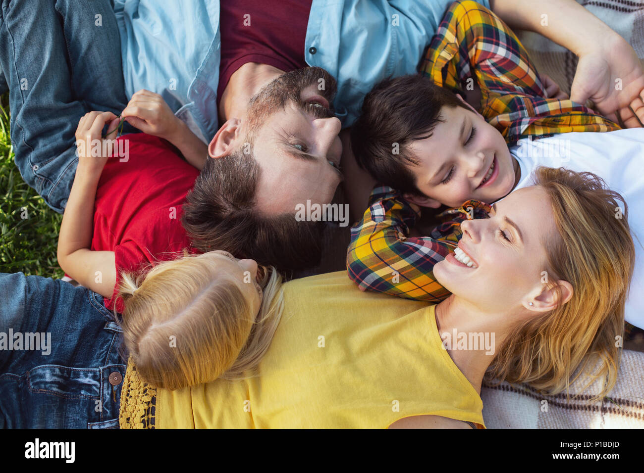 Joyful family relaxing together in the open air Stock Photo