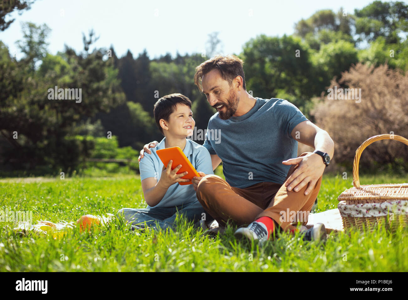 Exuberant daddy spending time with his son Stock Photo