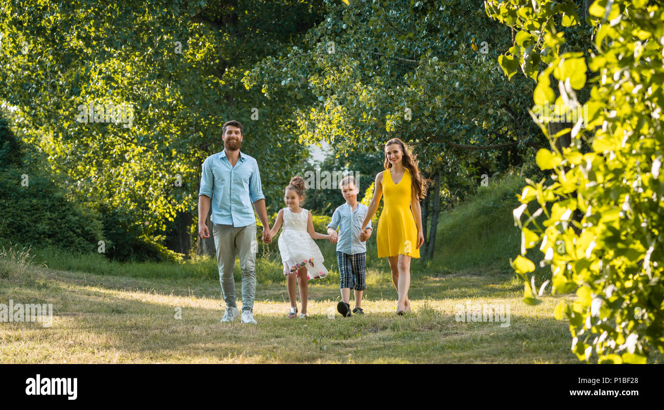 Did Recreational Walk Reference: Happy Family With Two Children Holding Hands During Recreational Walk
