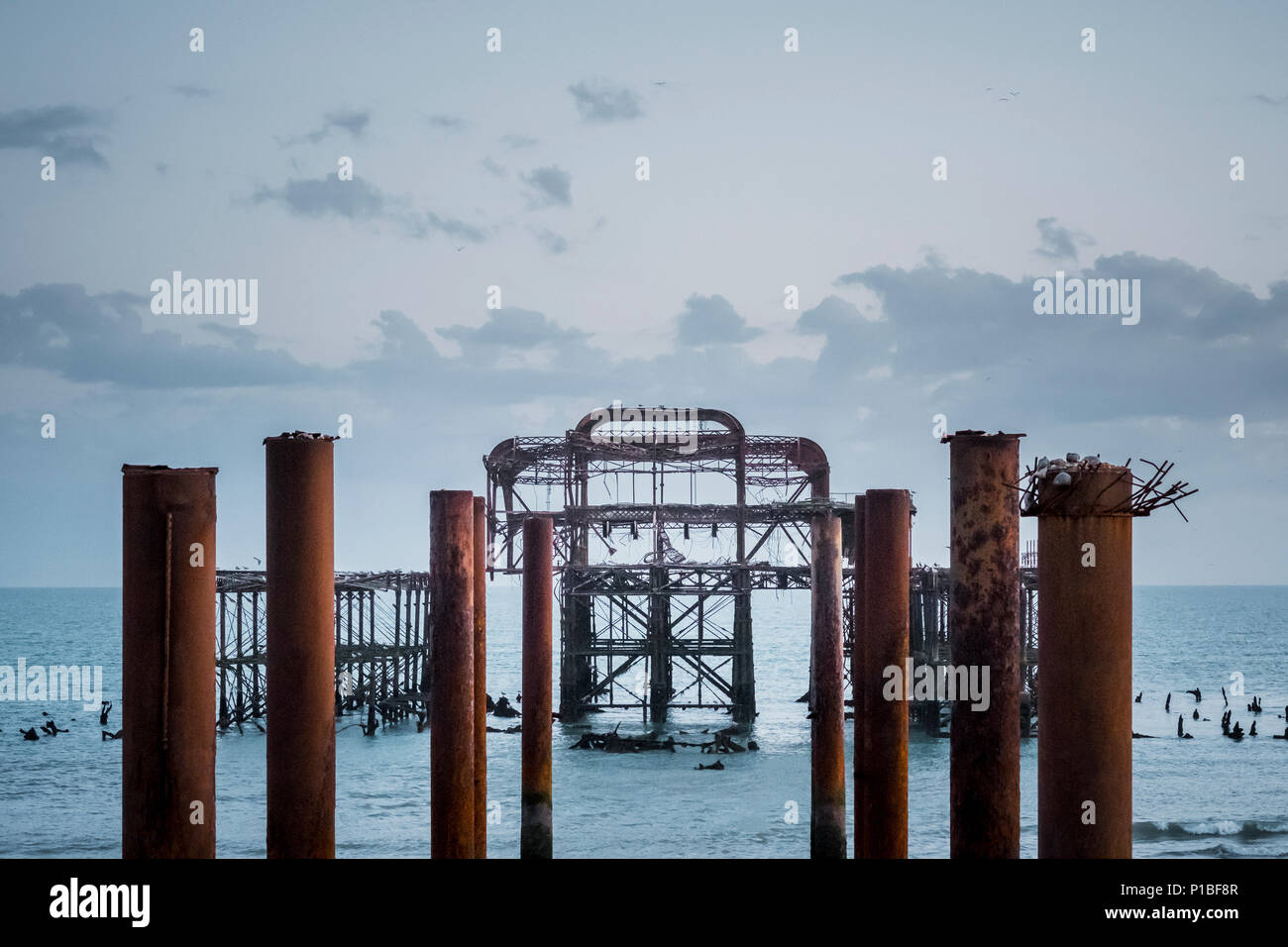 Burned West Pier by the sea, Brighton, England Stock Photo