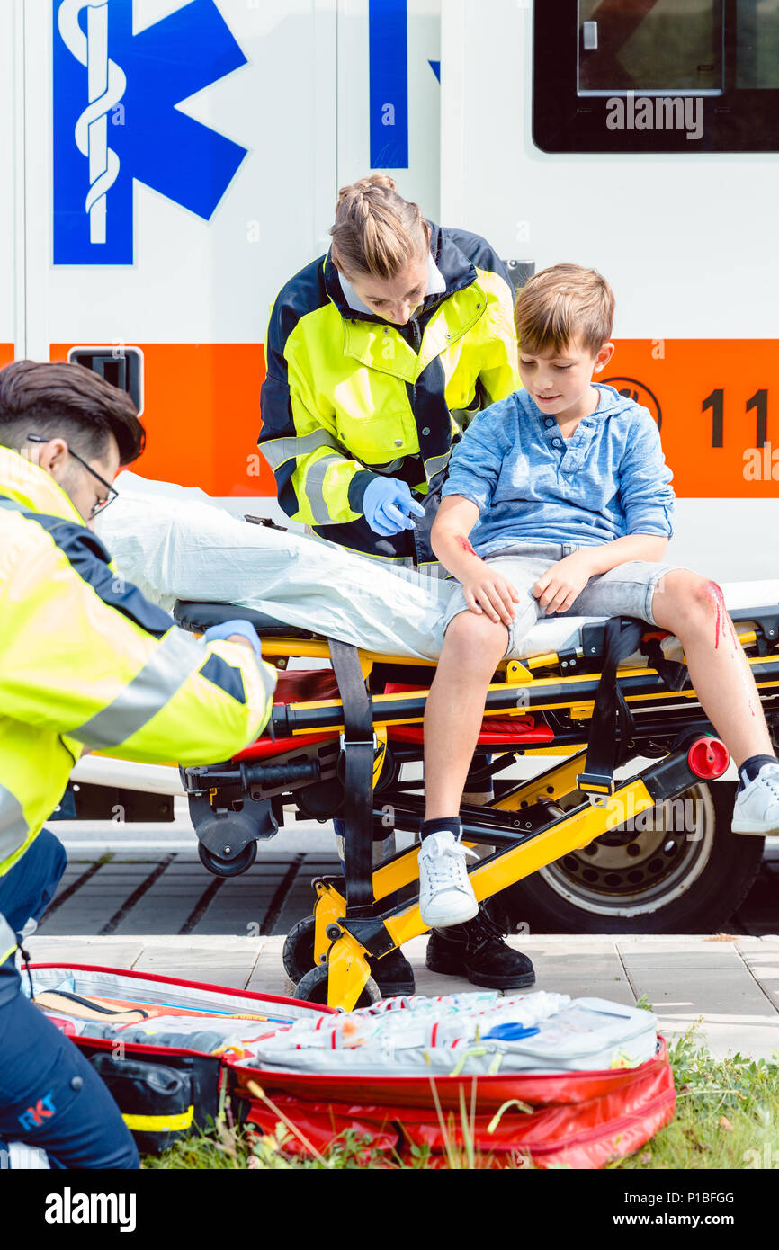 Emergency doctors caring for accident victim boy Stock Photo Alamy