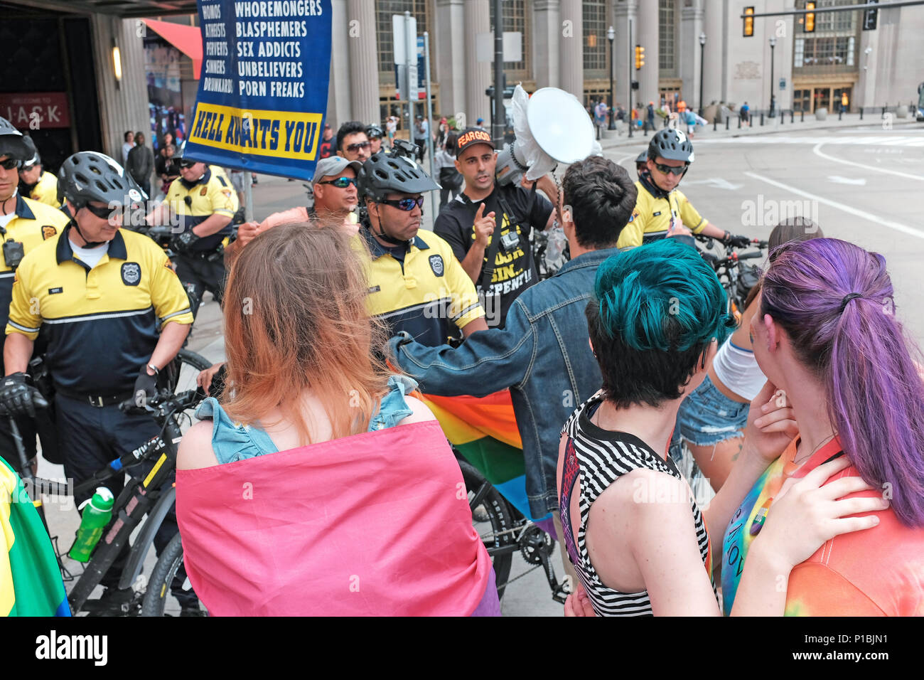 Religious zealots and 2018 pride day festivity participants clash with a war of words in front of Tower City Center in downtown Cleveland, Ohio, USA. Stock Photo