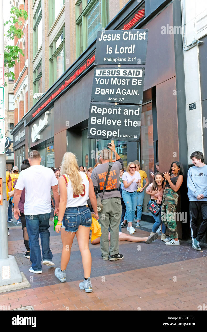 Religious zealot riles a young crowd on Euclid Avenue in downtown Cleveland, Ohio, USA. Stock Photo