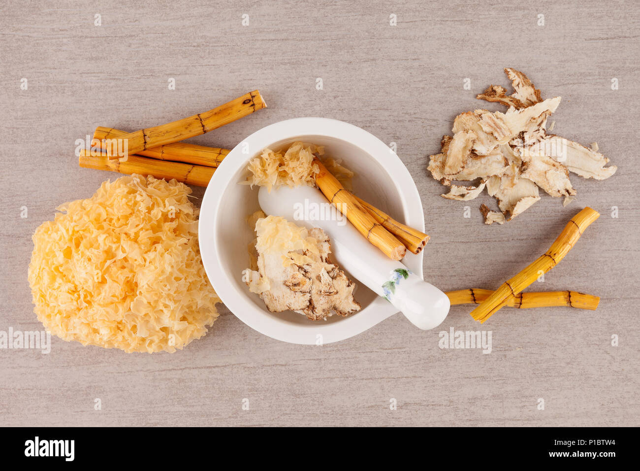 Traditional chinese healing herbs in mortar from above. Medicine for