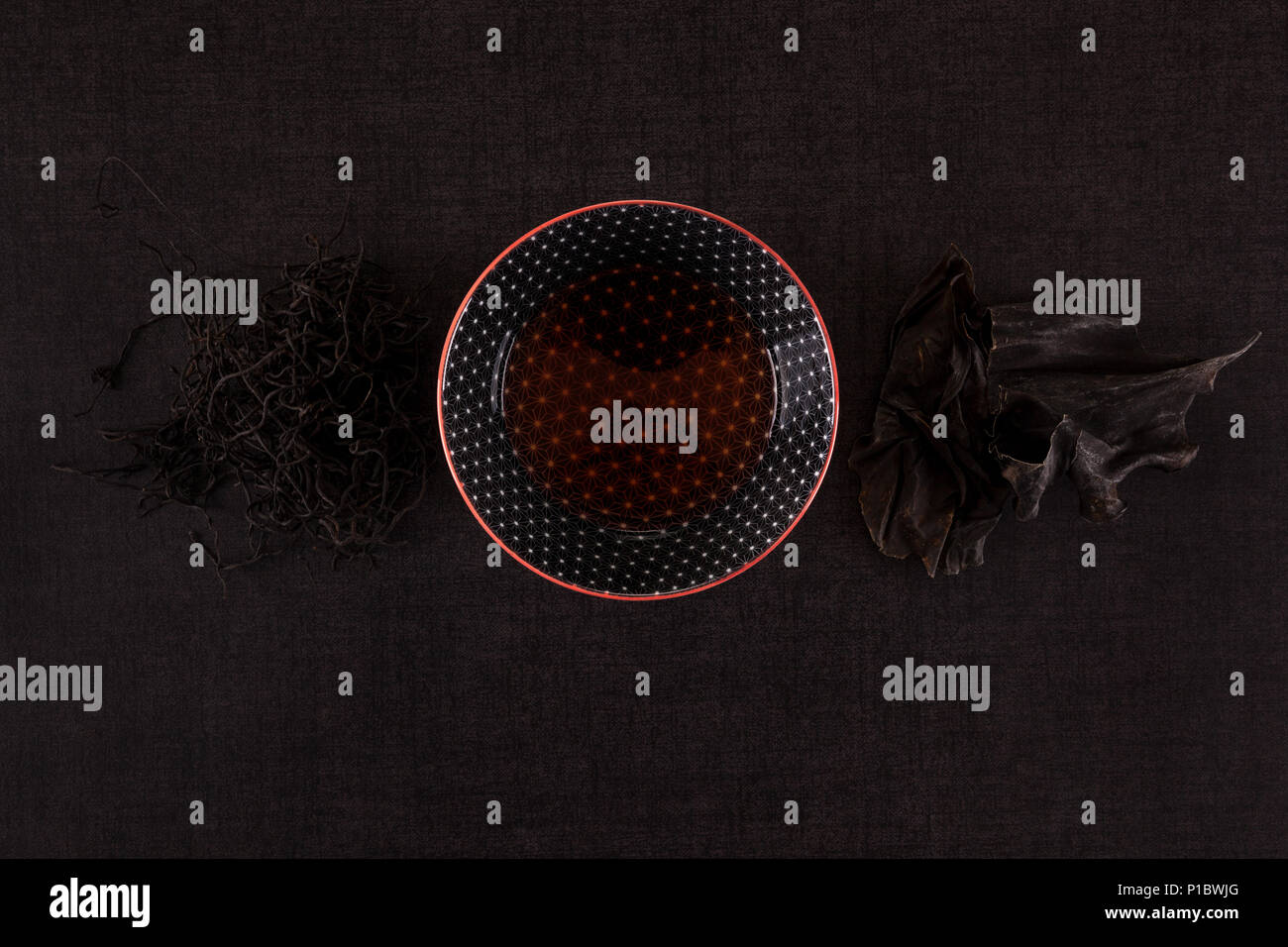 Traditional chinese medicine seaweed and Dan Shen on black background