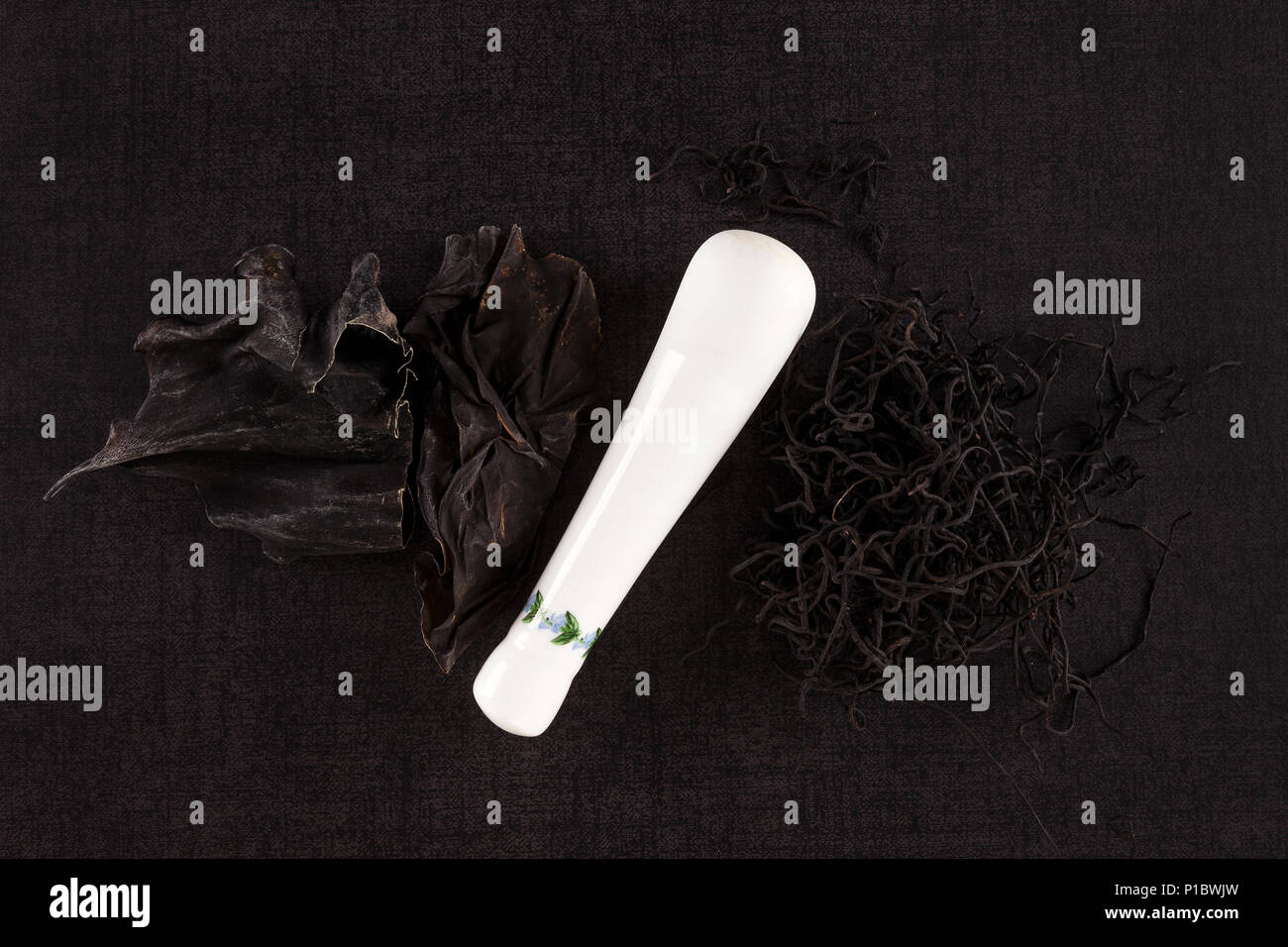 Traditional chinese medicine seaweed and Dan Shen on black background